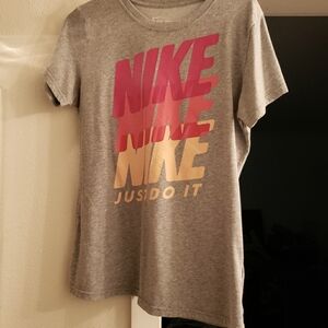 Nike shirt  with different colored letters